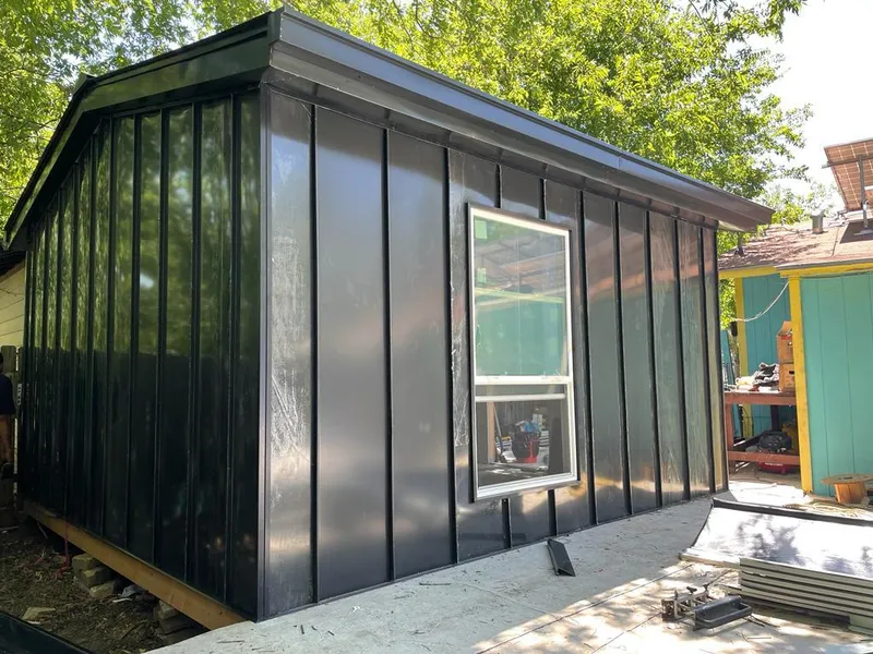 Black standing seam metal wall panels for Roof Inspection in Lovejoy